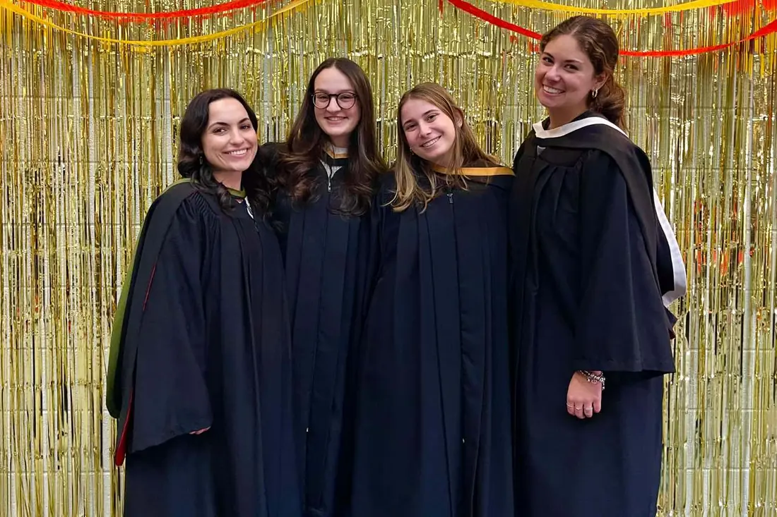 Graduating students in gowns at Golden Shabbat