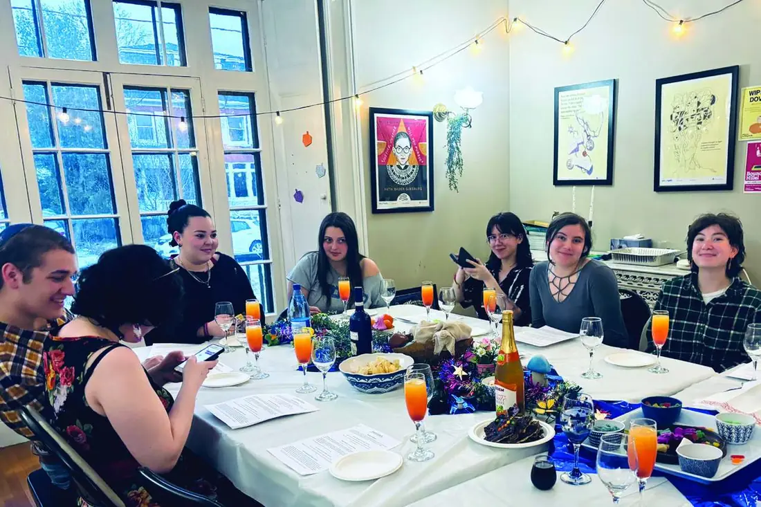 Students at a Rainbow Jews Shabbat dinner