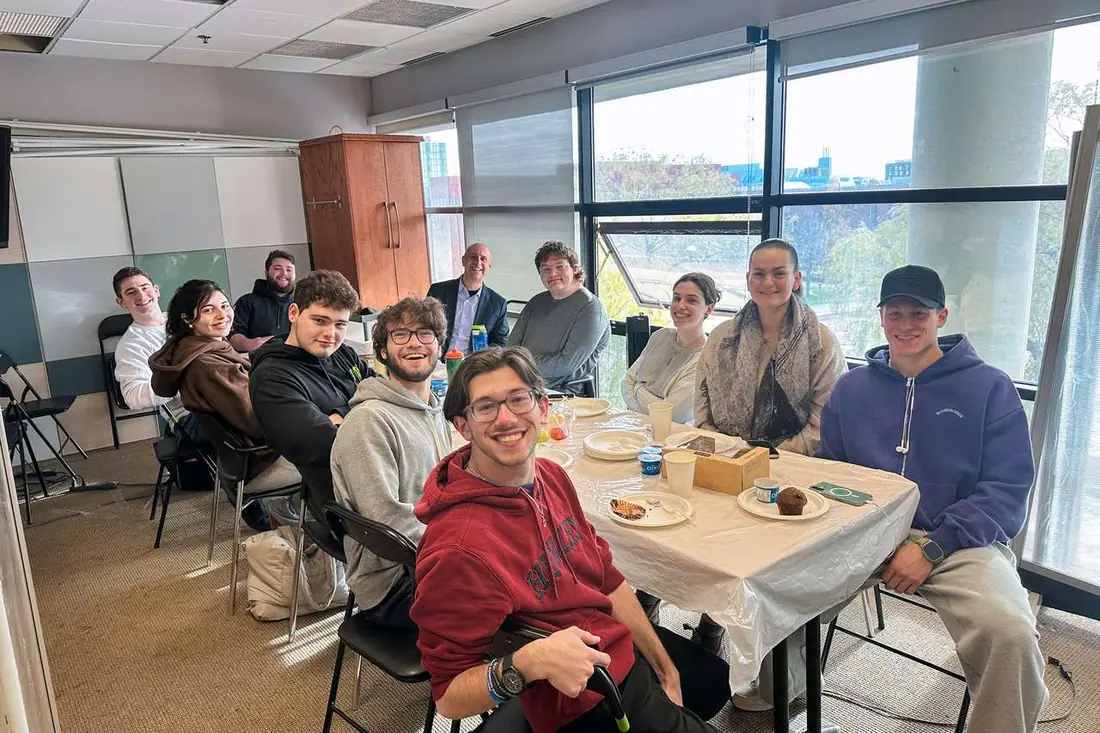 Jewish Learning Fellowship students in conversation around a table