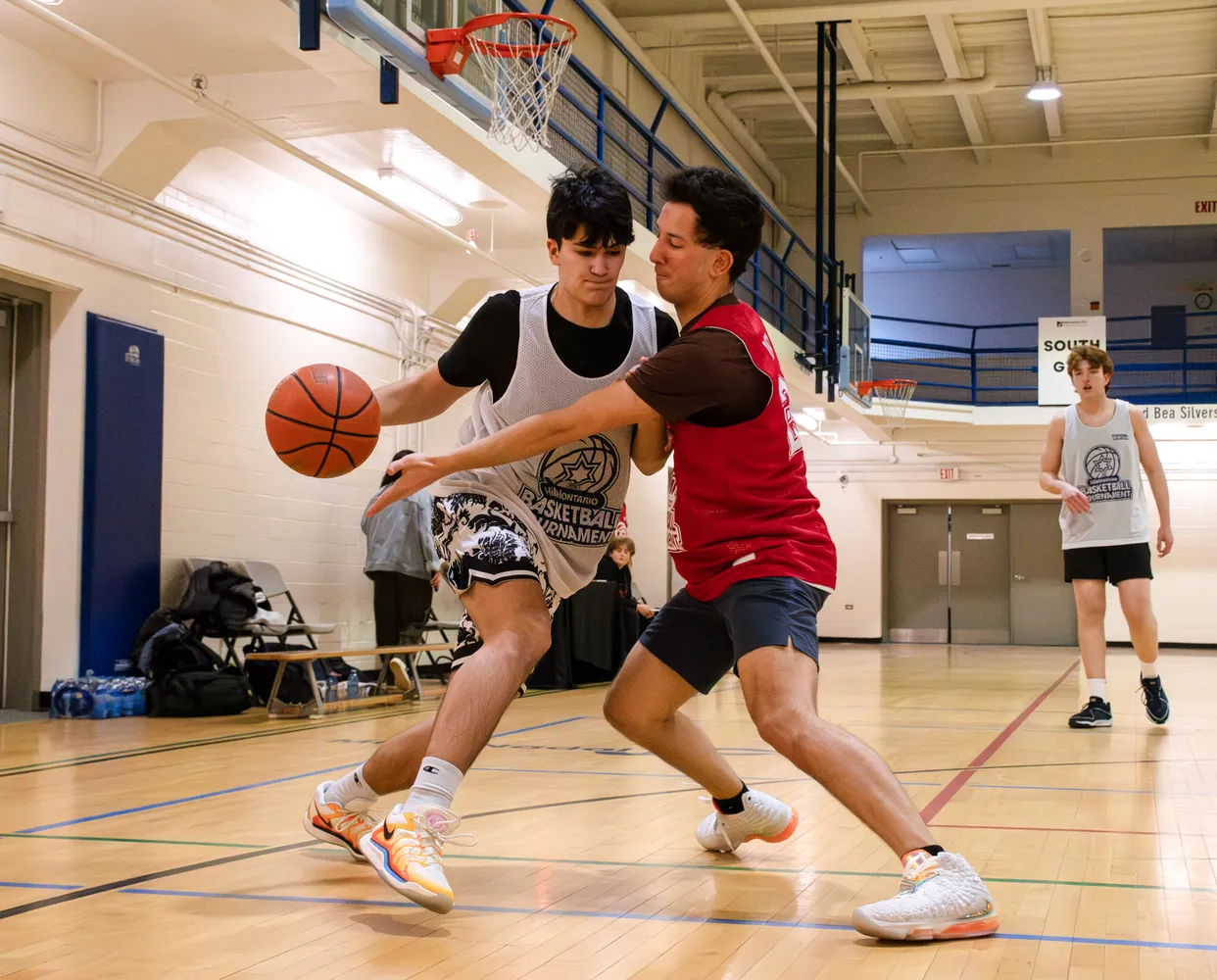 Two players battle one-on-one for the ball