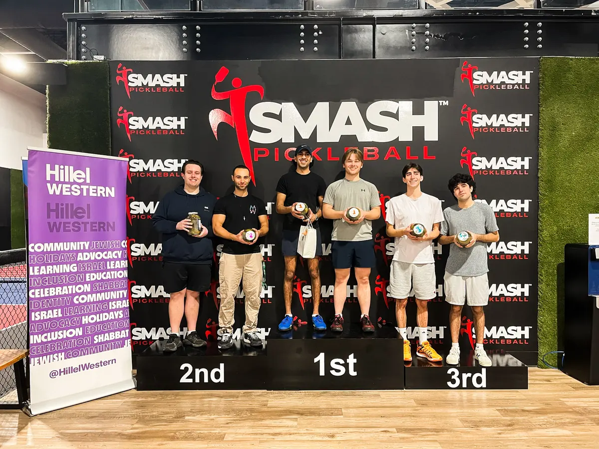 Winners on the 1st, 2nd and 3rd place podium at Hillel Western's SMASH pickleball tournament