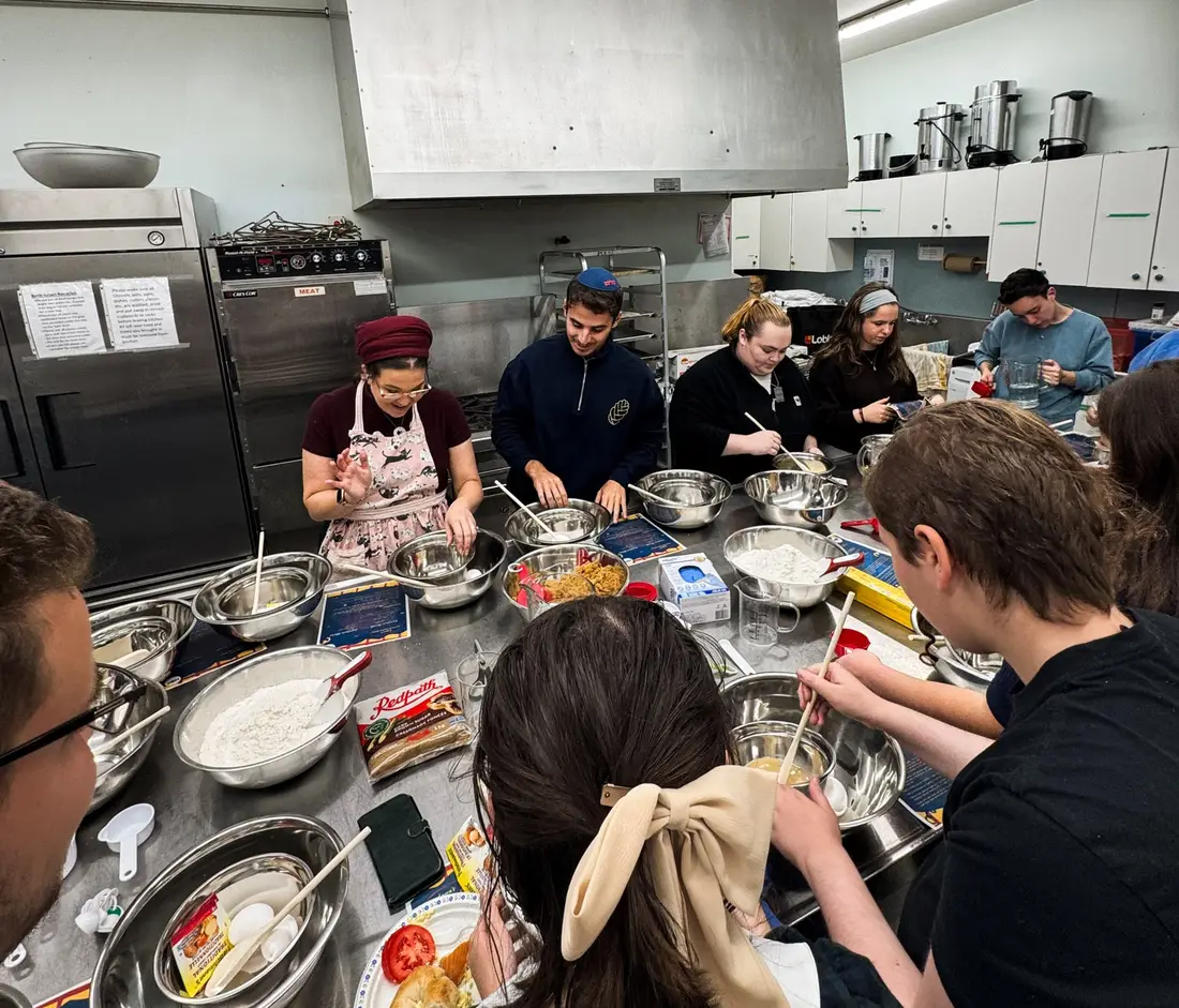 Students cooking together in a campus kitchen