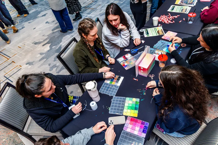 Fellows at a beading workshop during a skill-building session