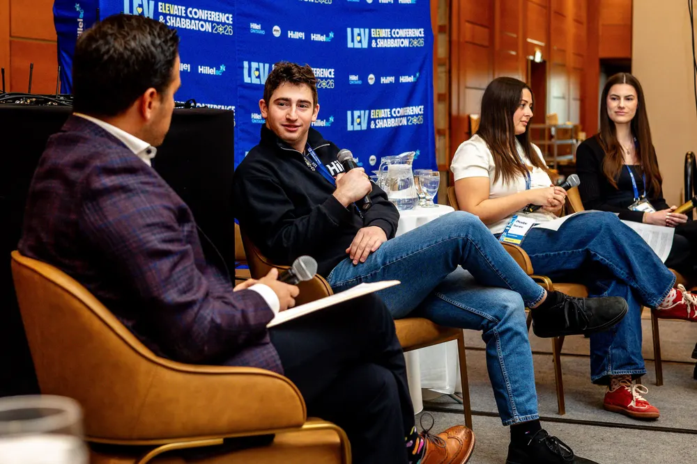 Menachem Guttman speaking on a student leadership panel