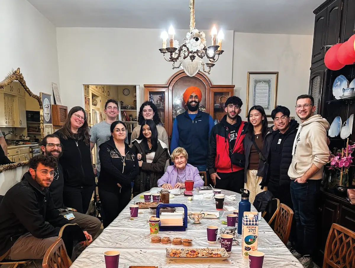 The cohort shares a home dinner in Israel