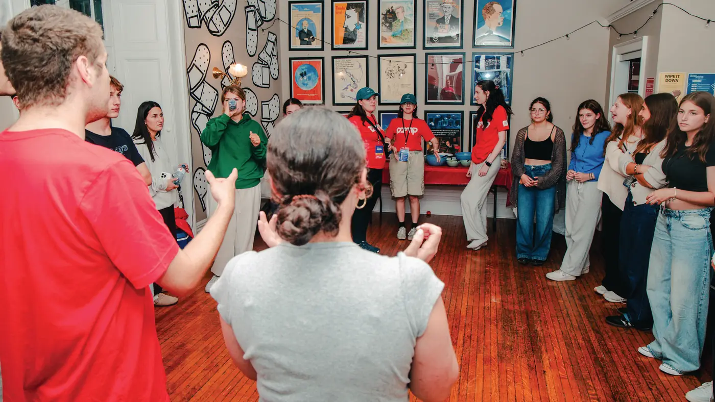 Students gathered in a circle at a Hillel house event